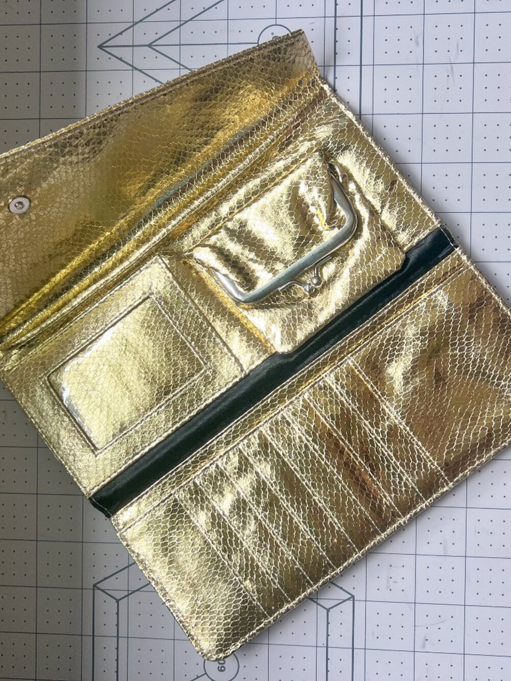 Gold metallic snakeskin-embossed trifold wallet